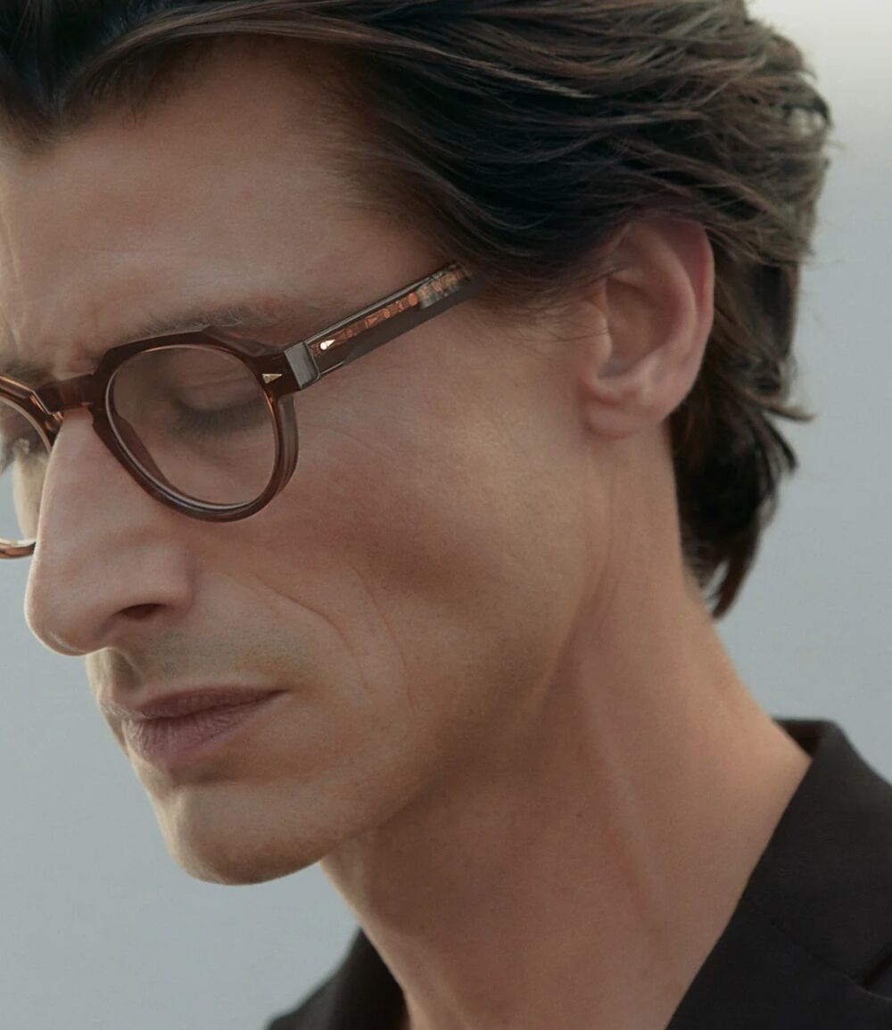 Man wearing tortoiseshell Ahlem optical frames